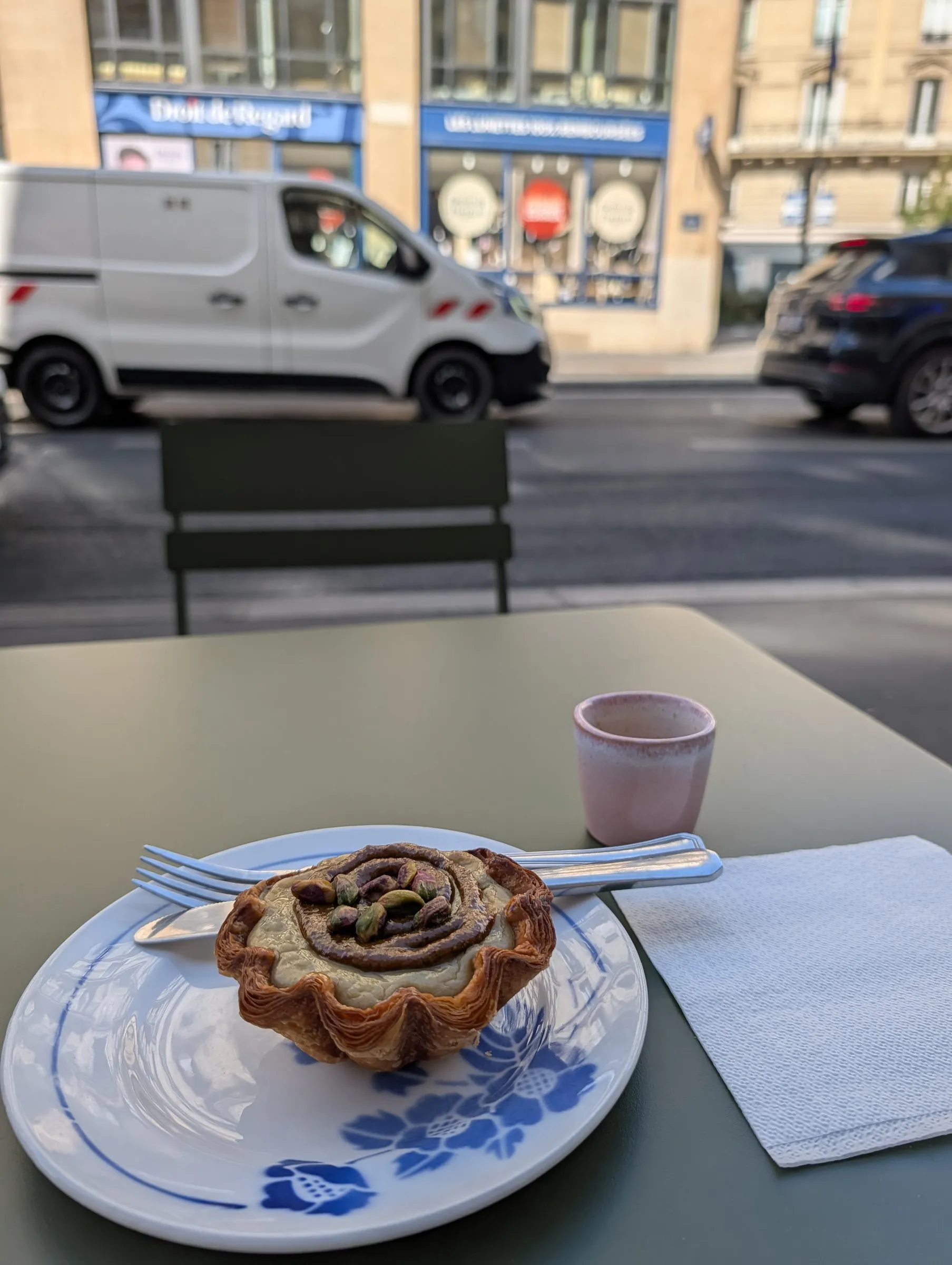 First afternoon: a pistachio pastry at a sidewalk table near the Grands Boulevards