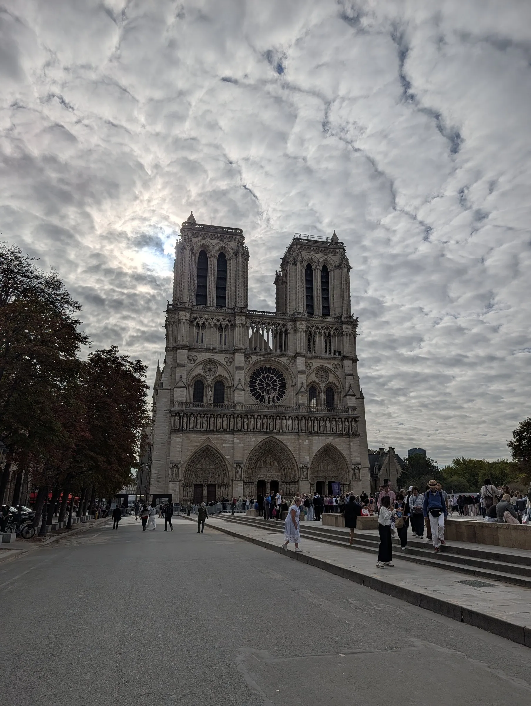 Notre-Dame's west front under a mackerel sky