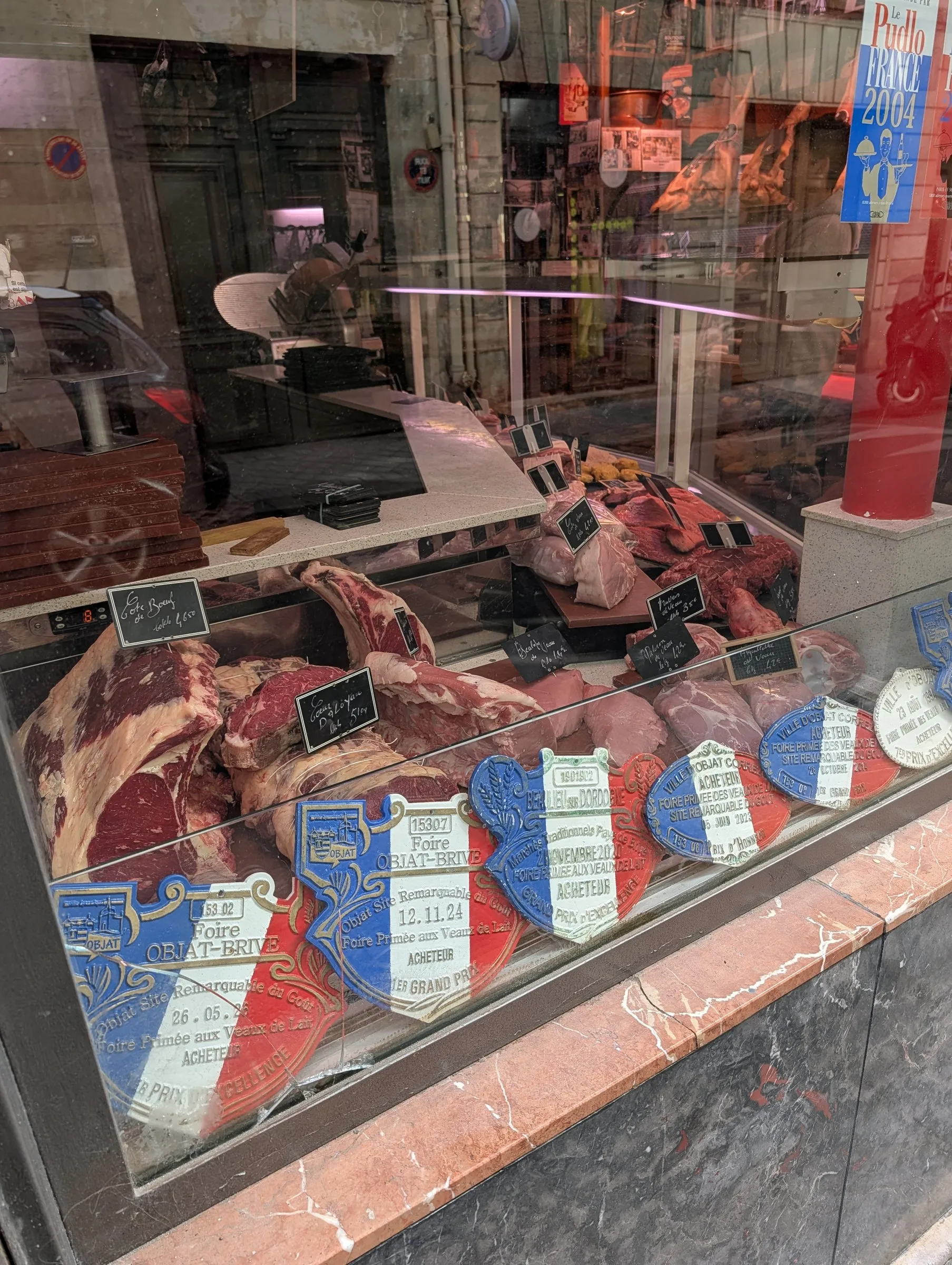 Prize-ribbon butcher's window on Île Saint-Louis