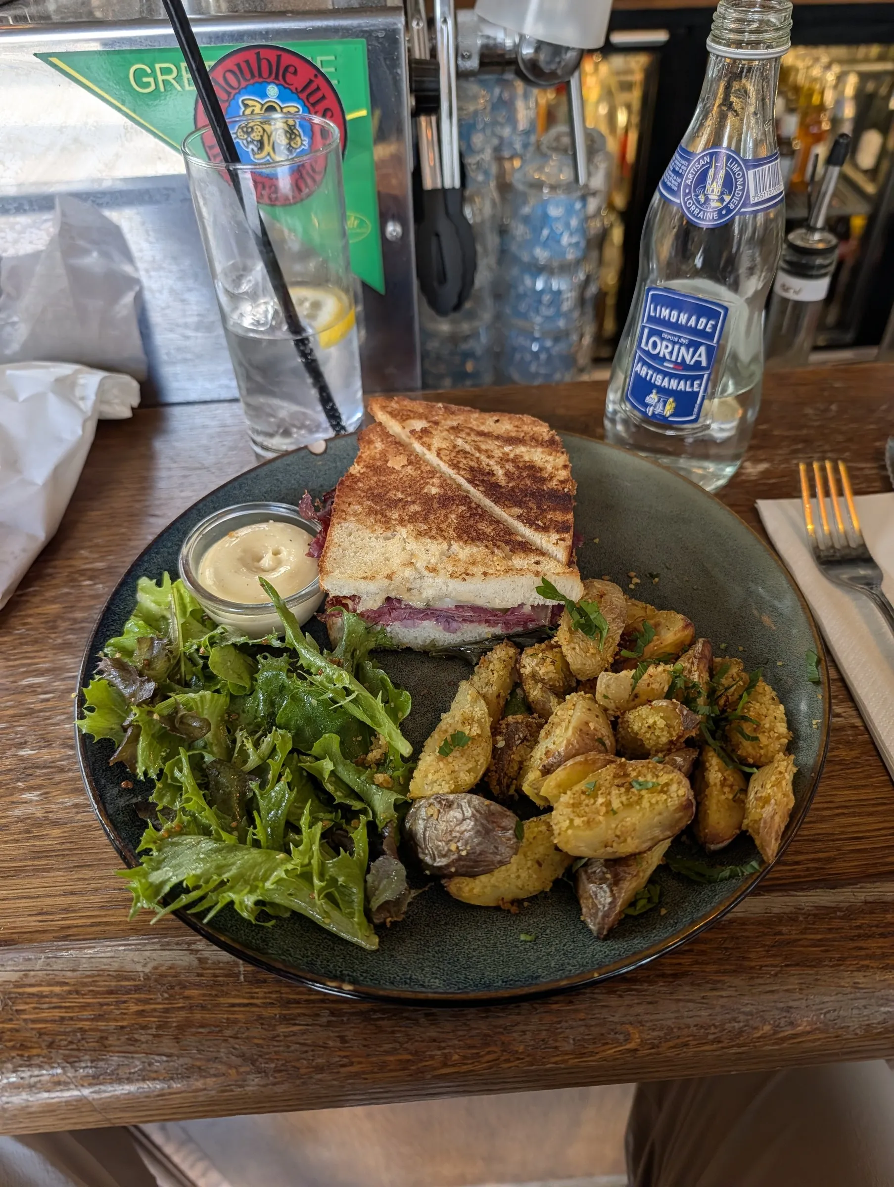 Lunch back near the hotel: a croque with roasted potatoes and a Lorina lemonade