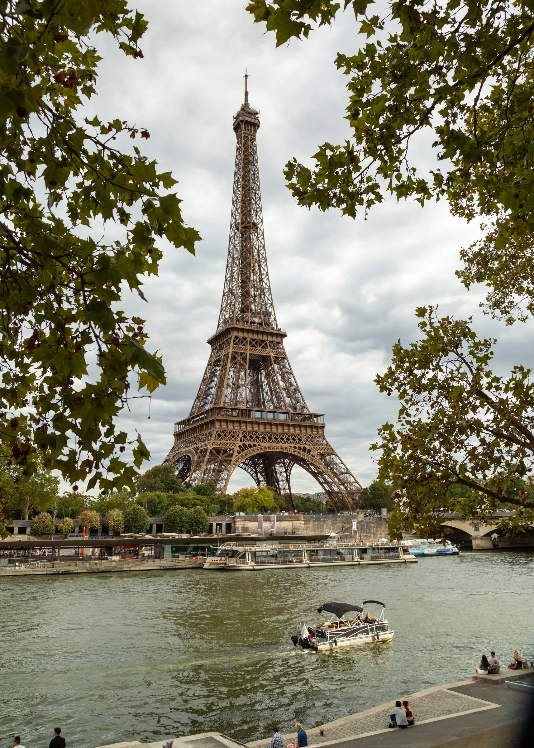 A tour boat on the Seine below the tower