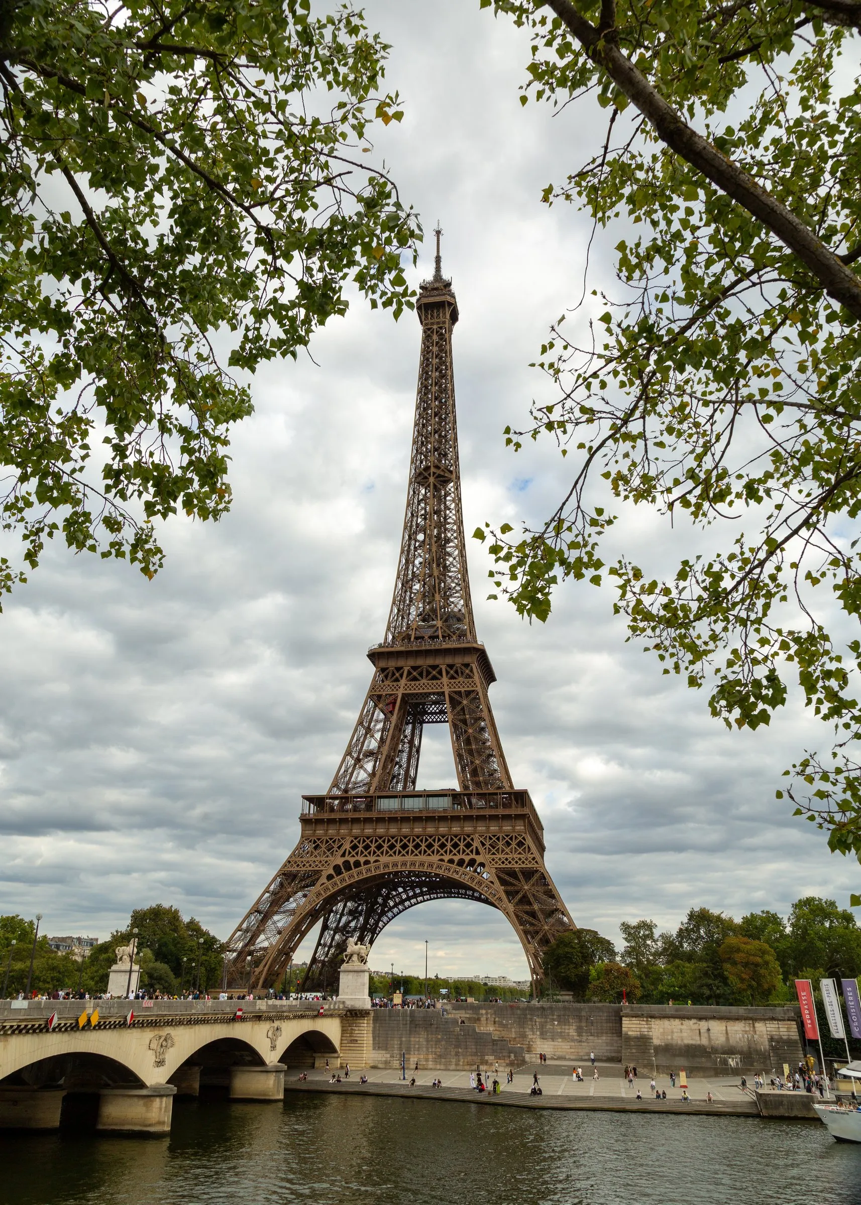 The tower and the Pont d'Iéna through the trees