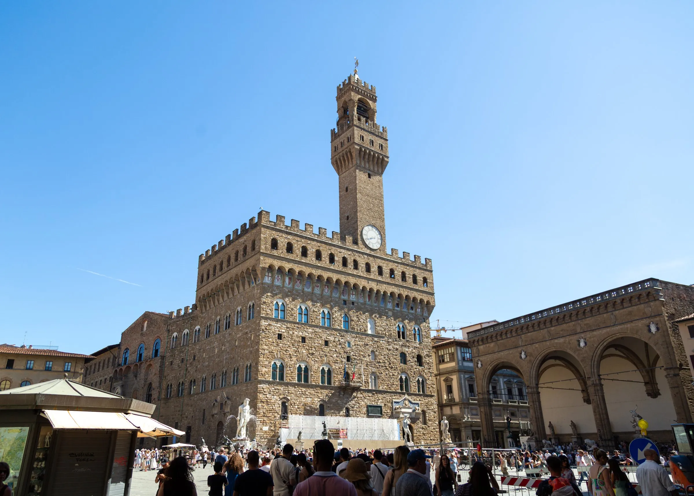 Palazzo Vecchio over a crowded Piazza della Signoria