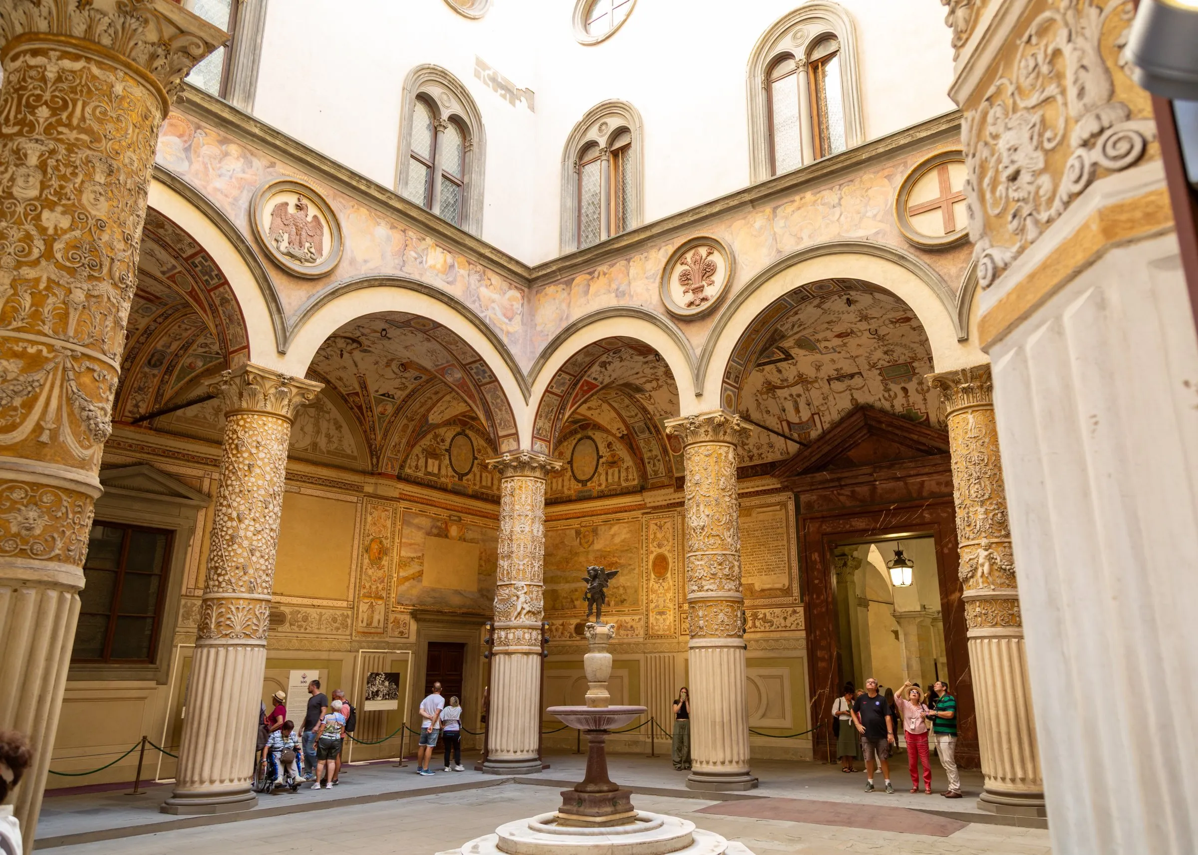 The Palazzo Vecchio courtyard, gilded columns and frescoes