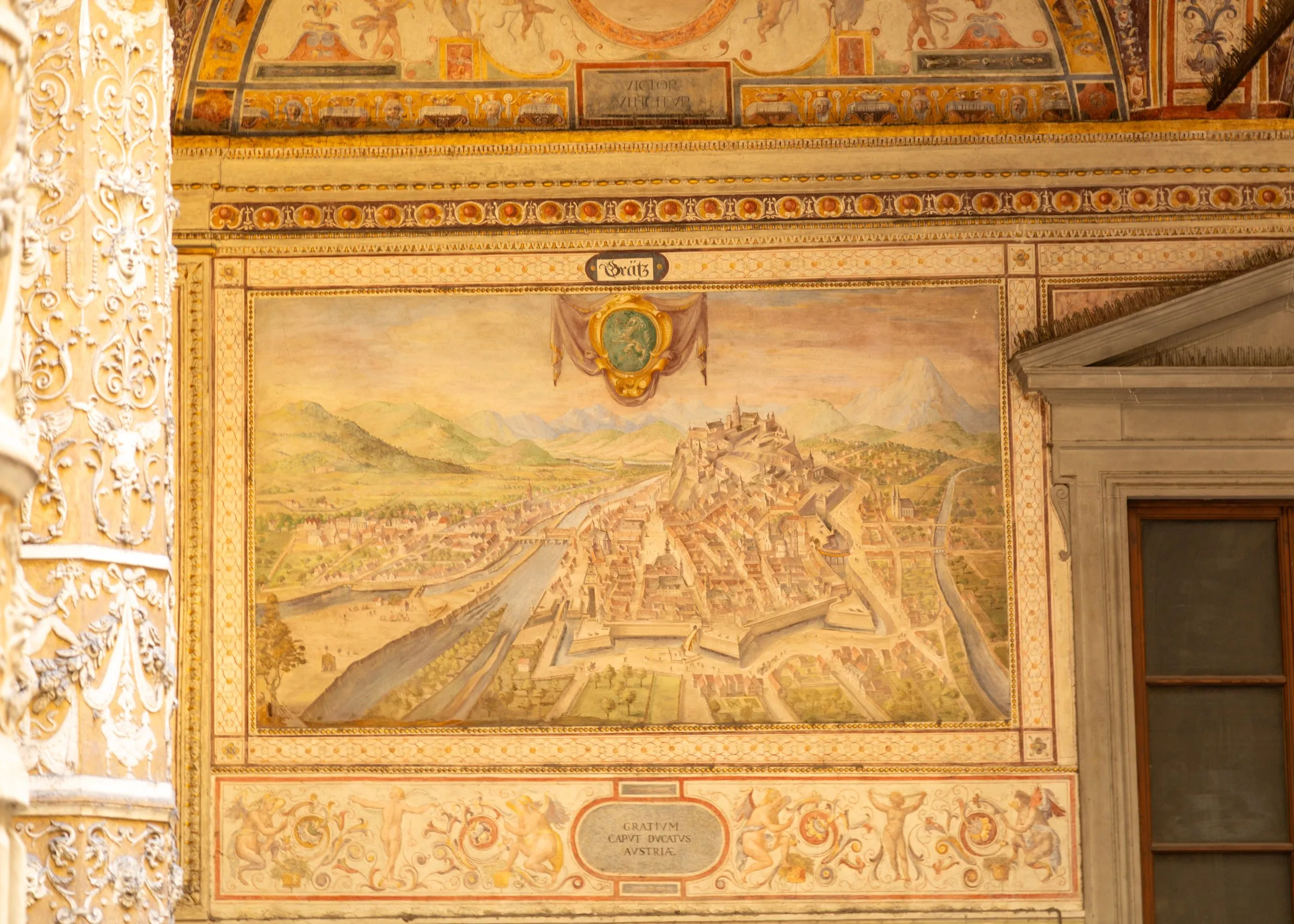 A fresco of a walled city in the courtyard