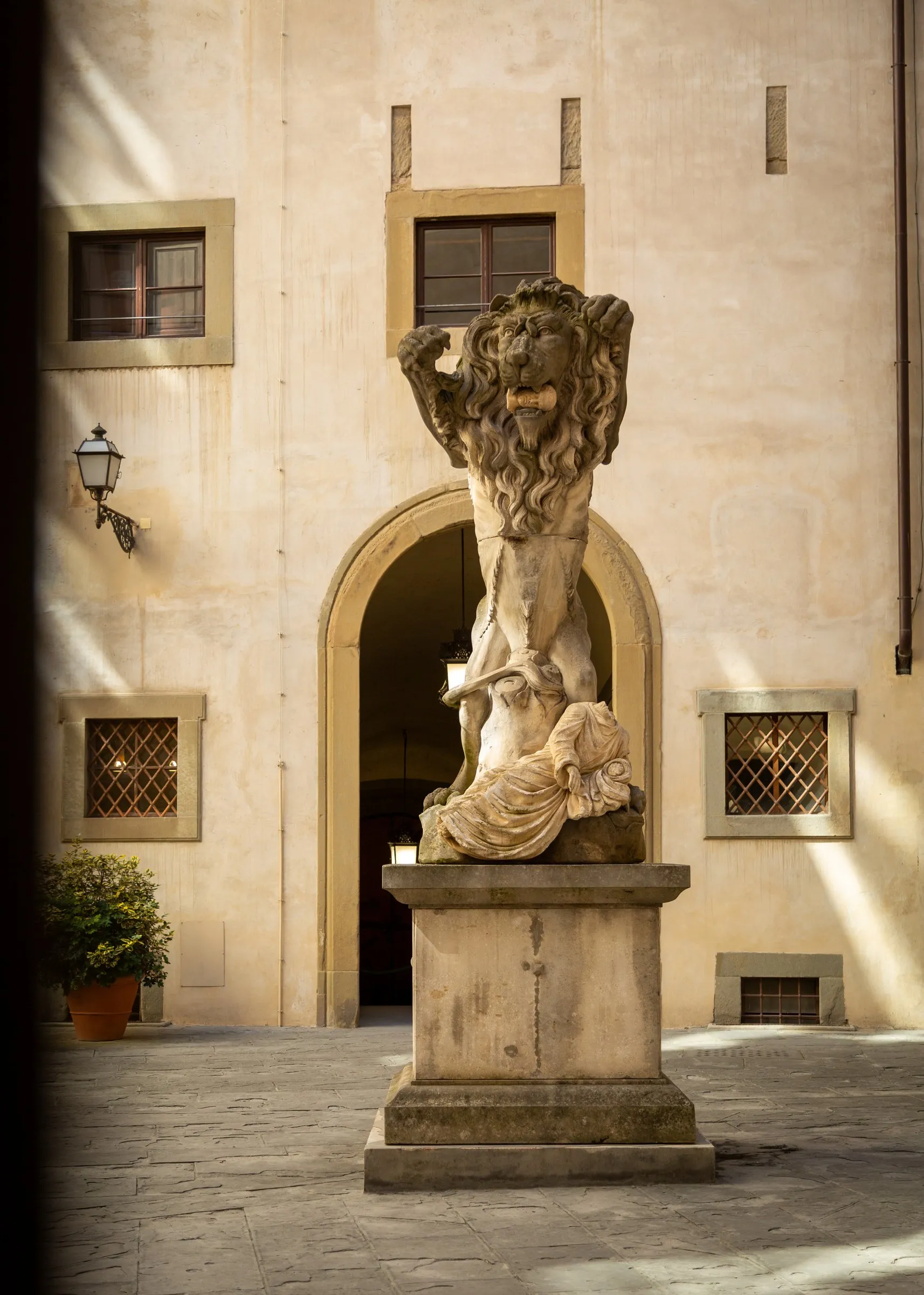 A marble statue in an inner courtyard of the palazzo
