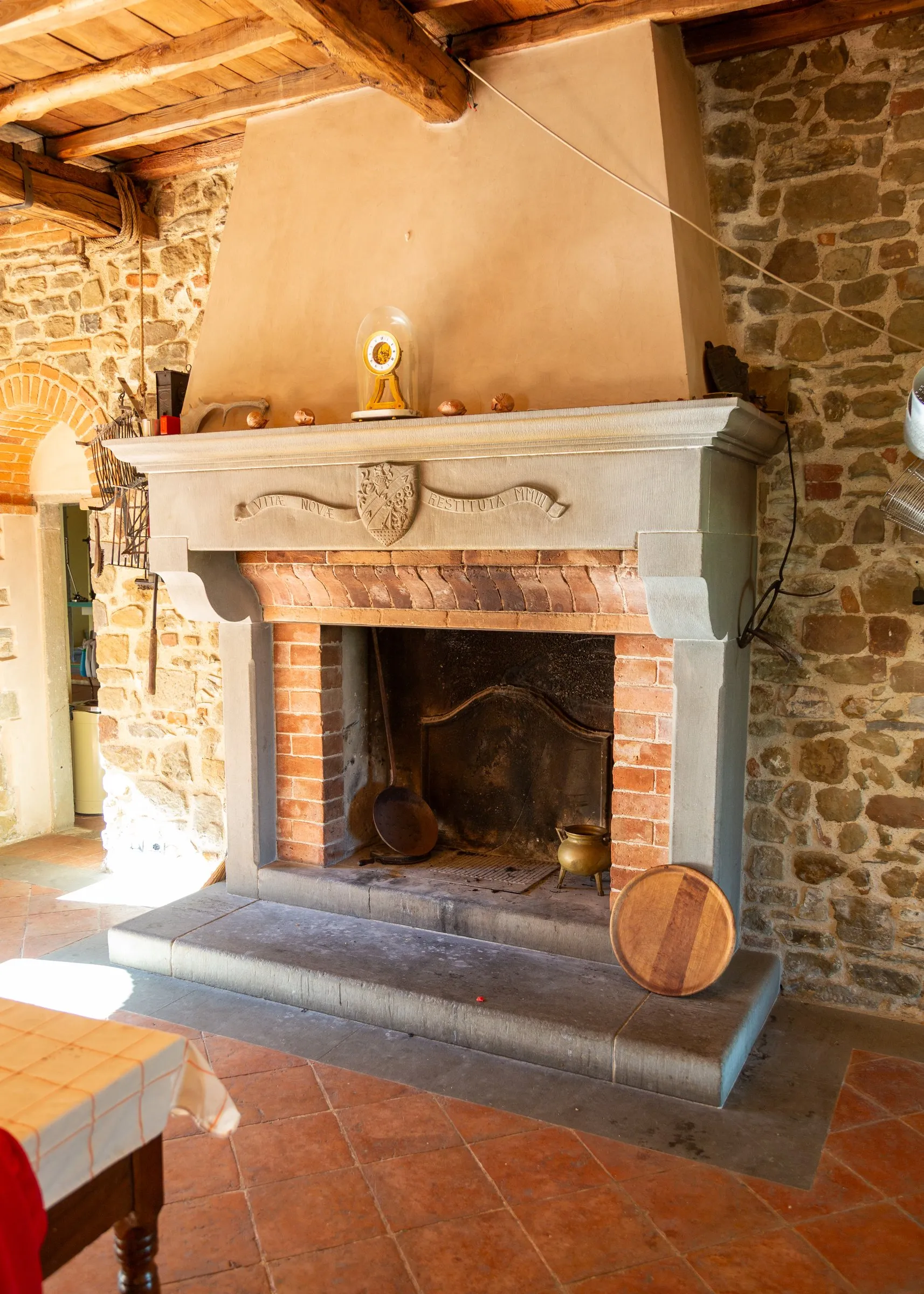 The farmhouse's stone fireplace