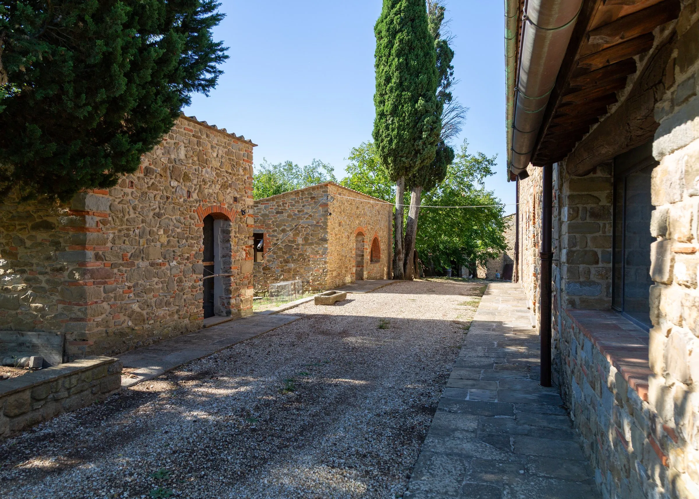 A lane between the farm buildings