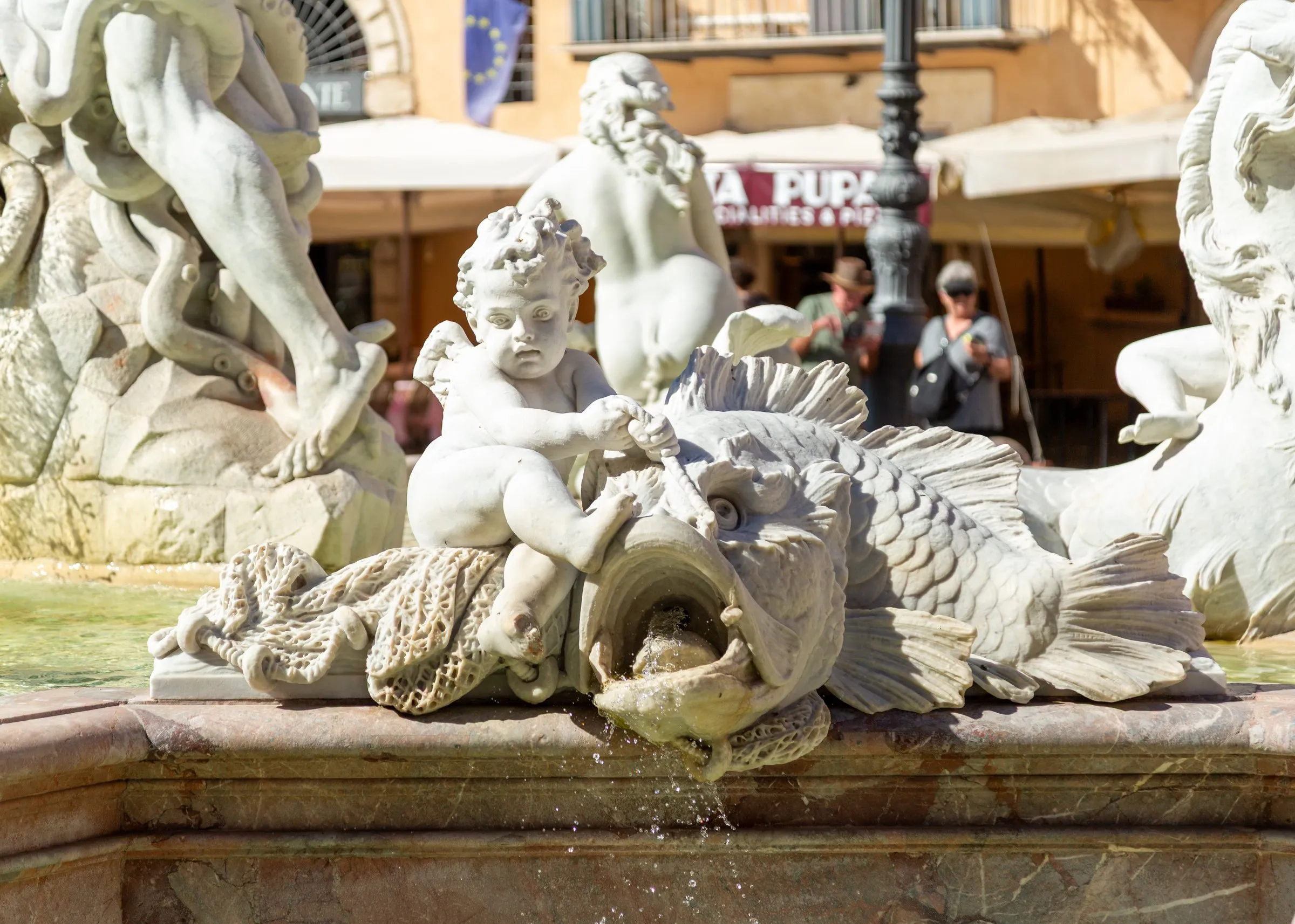 Putti and a dolphin on the Neptune Fountain