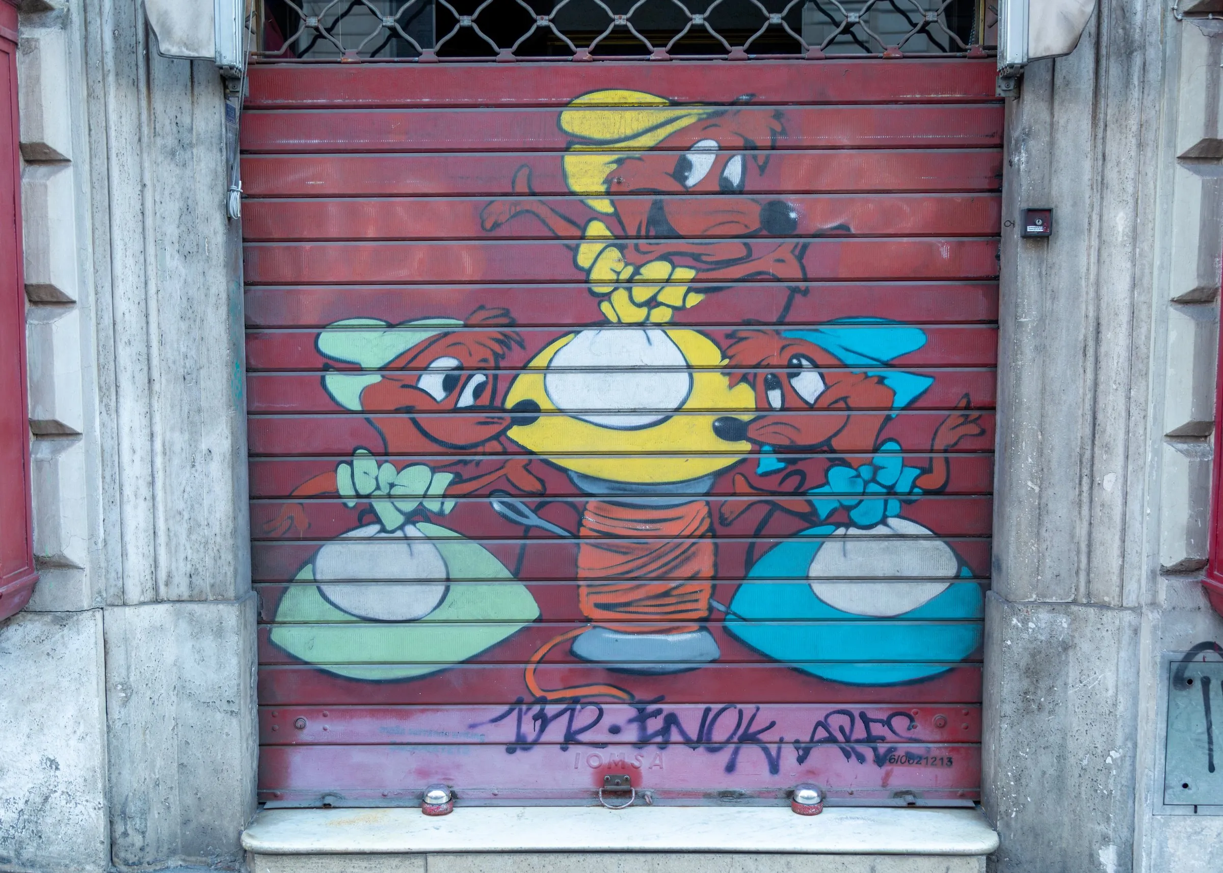 A painted shutter on the walk to the Colosseum