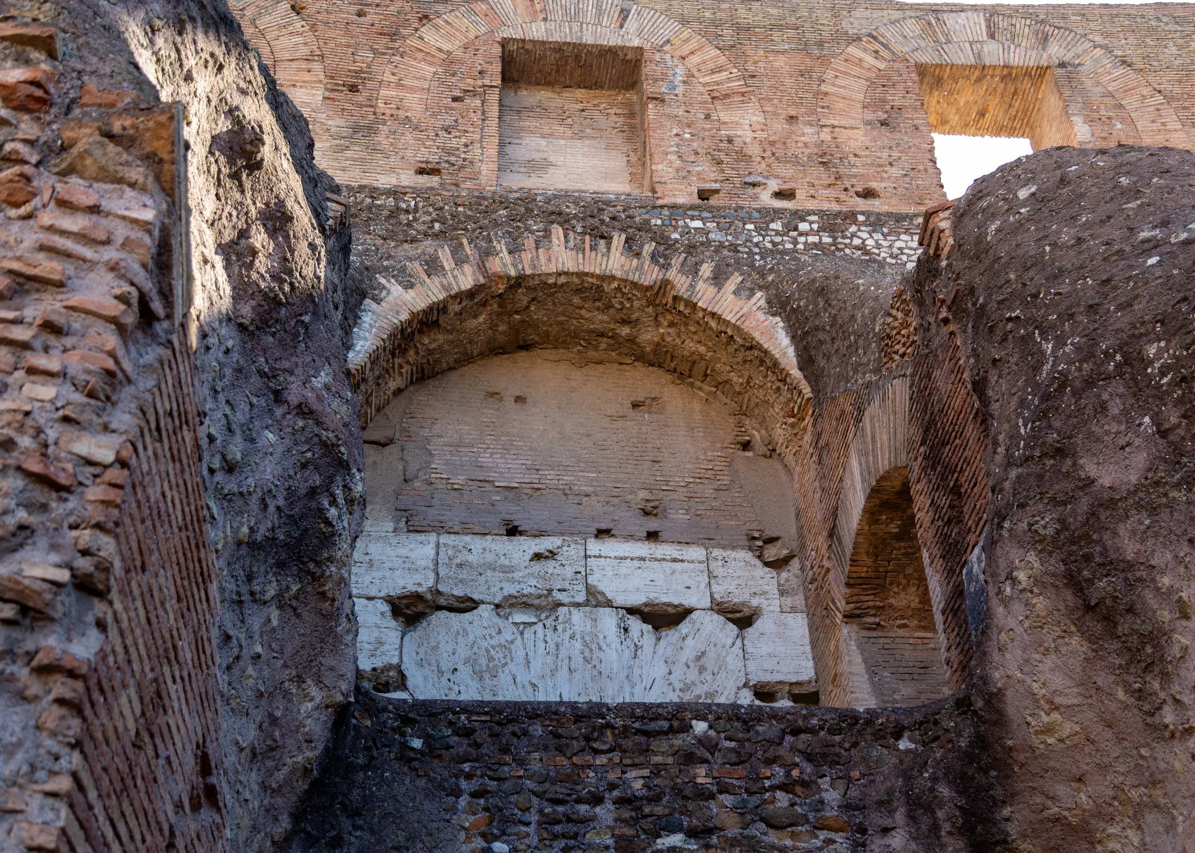 Brick and travertine inside the Colosseum's walls