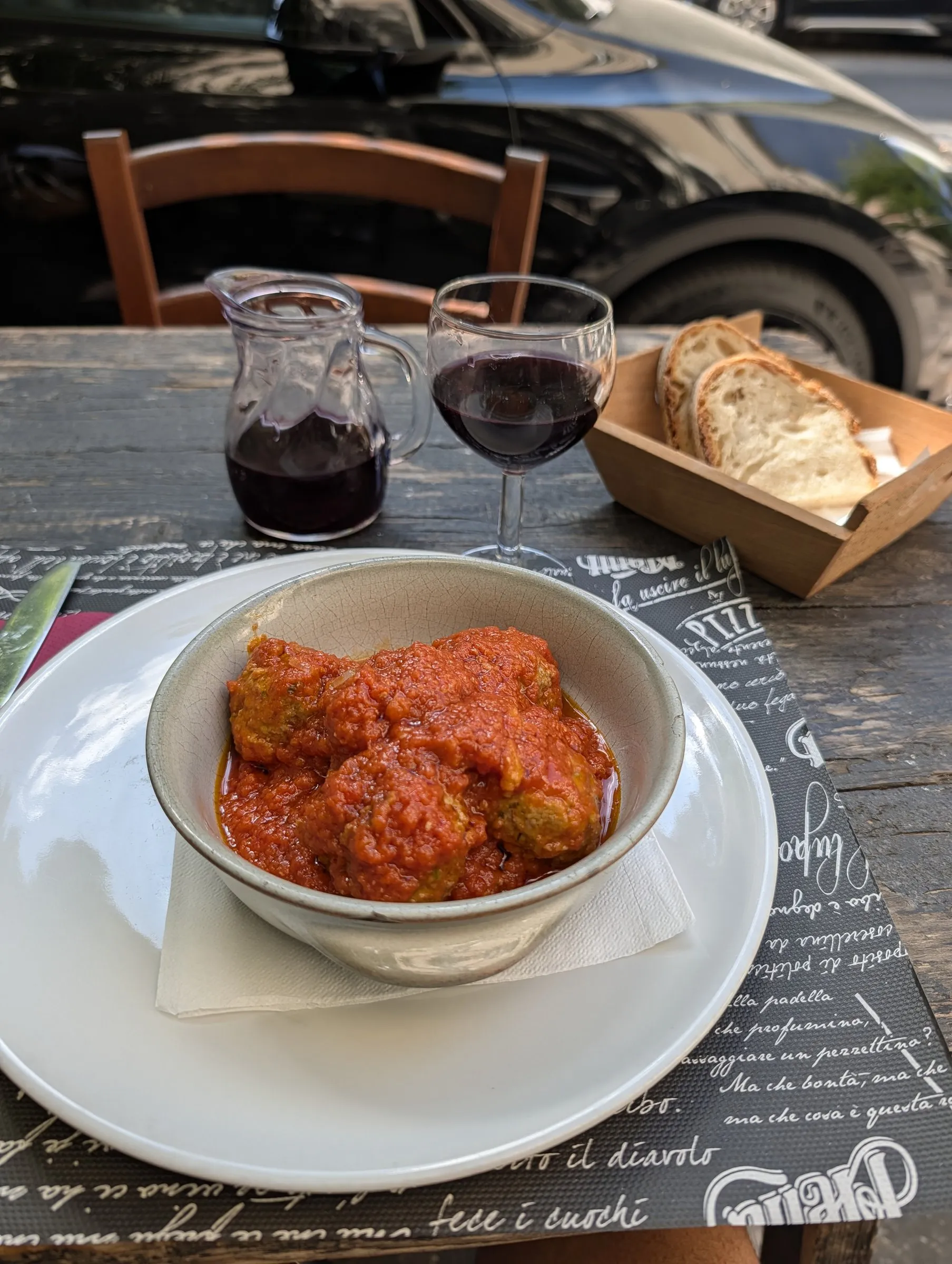 Late lunch: meatballs in tomato sauce and house red