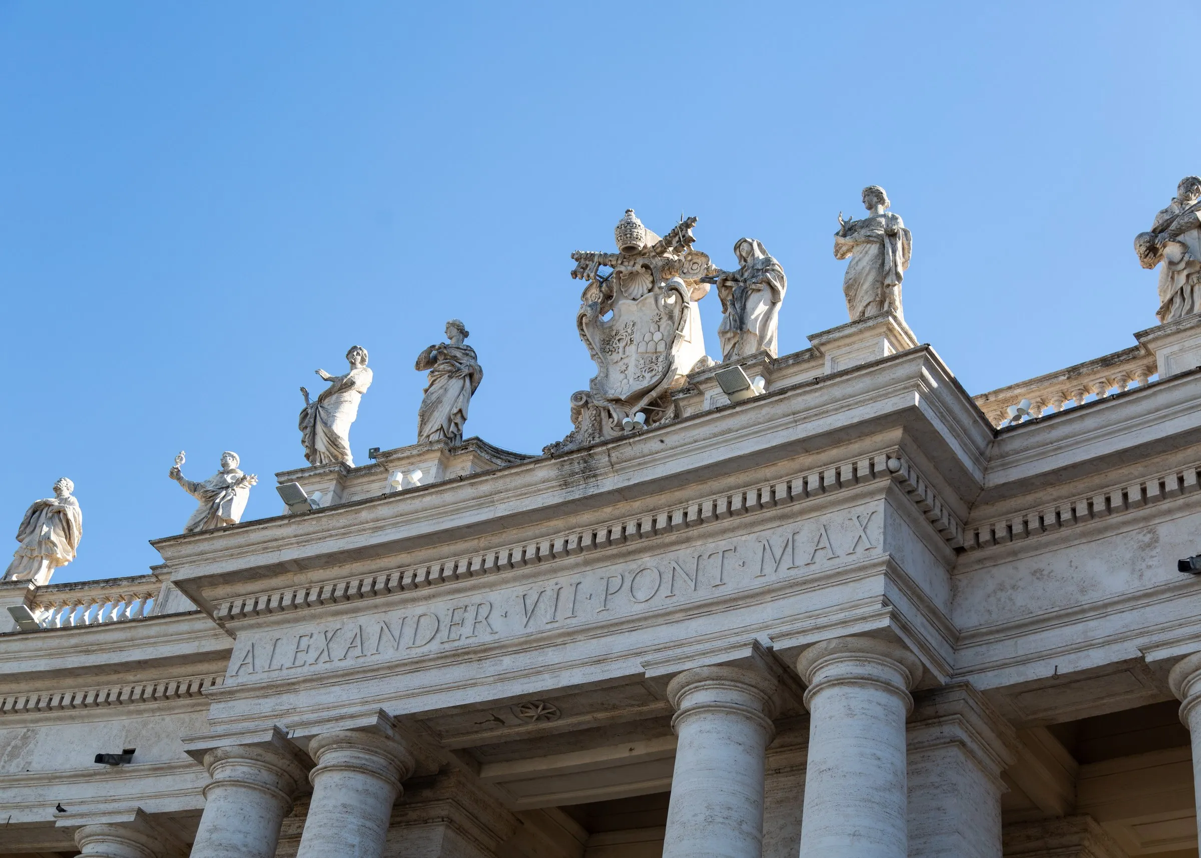 Saints on Bernini's colonnade, with Alexander VII's name