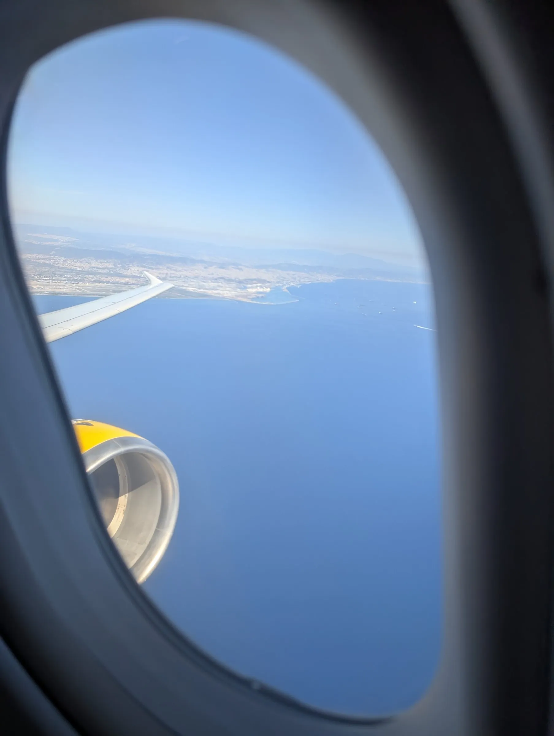 Vueling window seat, from the backup phone I keep for games on flights (its clock was still on Portland time)