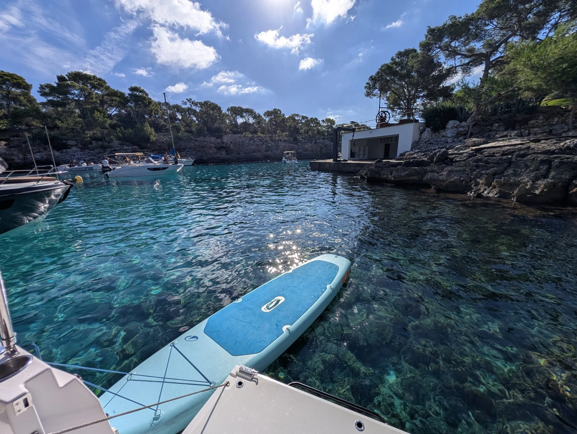 First cove stop: turquoise water and a paddleboard
