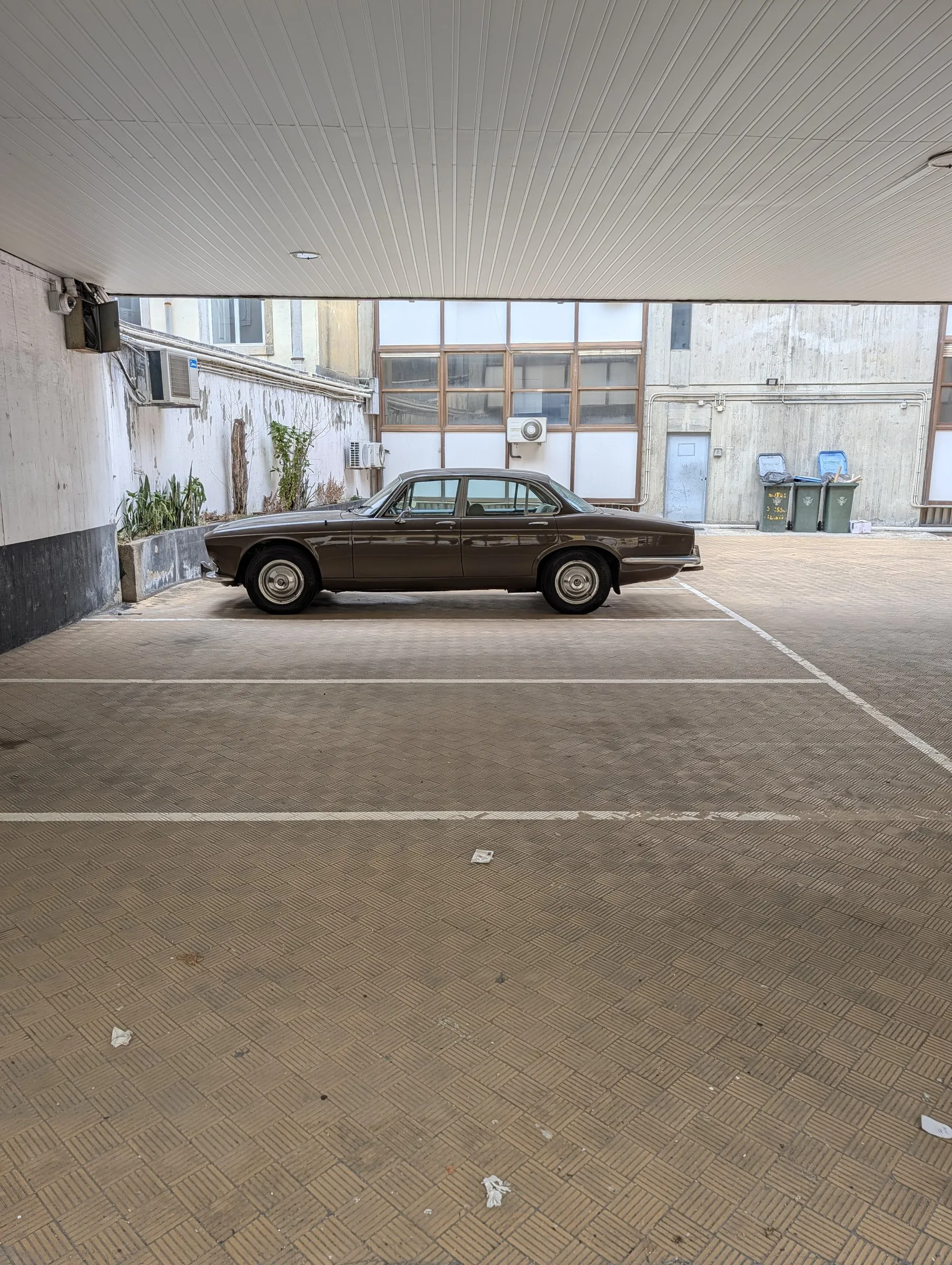 A classic car in a courtyard