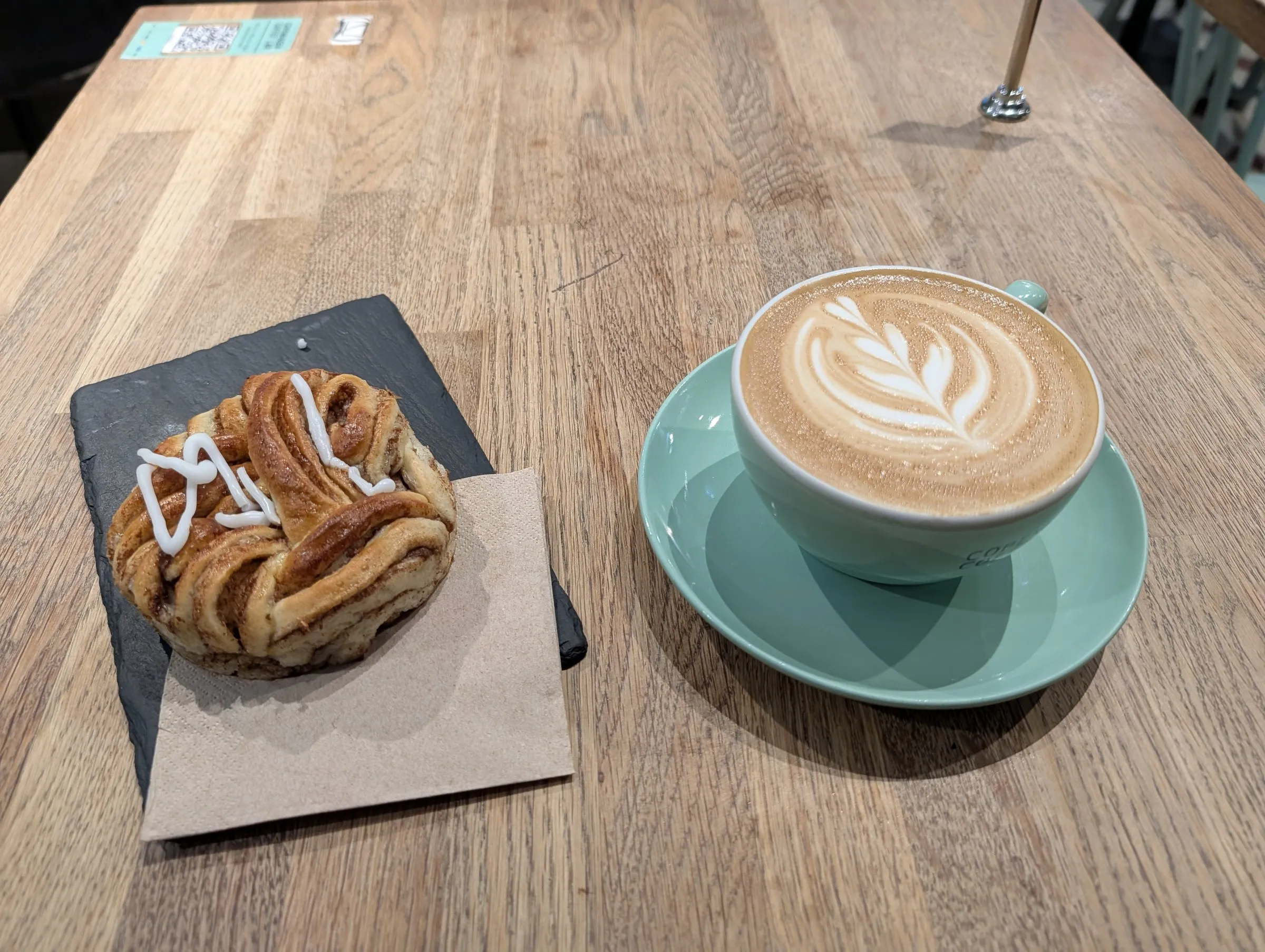 Last-morning cinnamon bun and flat white