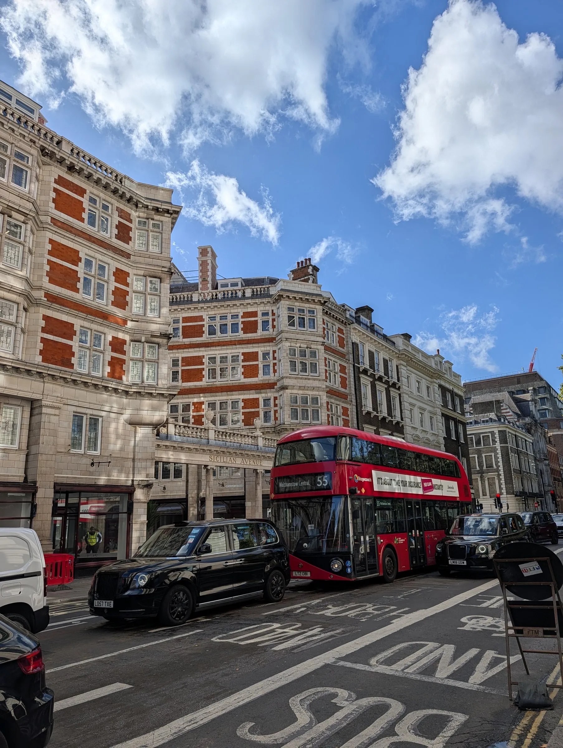 Black cab and a red bus